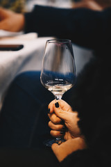 A glass of rose wine in hand