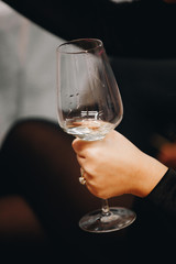A glass of wine held in hand