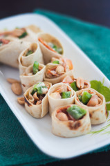 Sushi-Style Wraps with chicken pepperoni, vegetables and nuts. Healthy snacks.