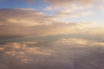 clouds at sunset from iljuminatora plane sky Sun travel