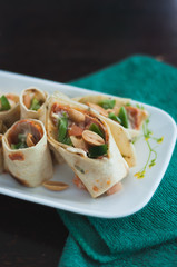 Sushi-Style Wraps with chicken pepperoni, vegetables and nuts. Healthy snacks.