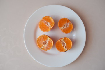 Juicy tangerines on a plate