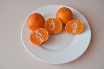 Juicy tangerines on a plate