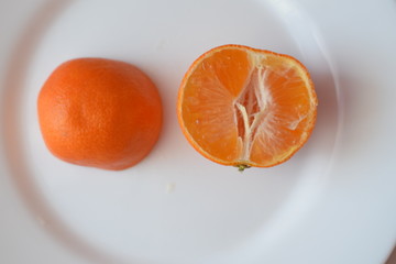 Juicy tangerines on a plate