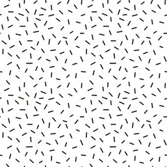 Abstract dash seamless pattern, Memphis style background with small dashes, retro black and white vector texture