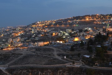 Fototapeta na wymiar Jerusalem at dusk, night view of city hillside, Israel