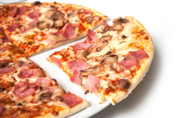 closeup of italian pizza margarita in a white plate on white background