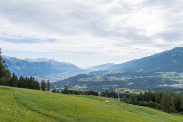 Fototapeta na wymiar Cable car (Muttereralmbahn) over Innsbruck valley, Austria