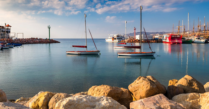 Morning in marina with moored yachts and pleasured boats in Eilat – famous tourist resort and recreational Israeli town