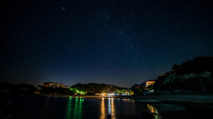 Stars in night sky near a beach, Japan