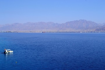 Red Sea turquoise water beach and mountains in Eilat, Israel