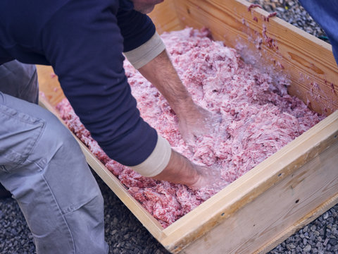 Crop hands mixing minced meat
