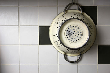 Metal Colander Hanging on Wall