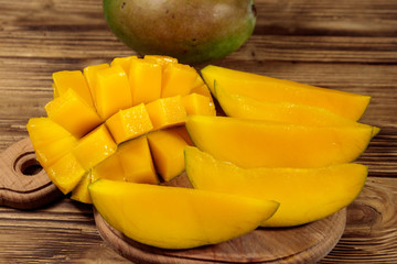 Fresh mango fruit on wooden table