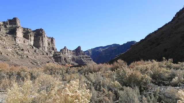 Rural desert mountain canyon sage brush valley. Nine Mile Canyon, Utah. World’s longest art gallery of ancient native American, Indian rock art, hieroglyphs, pictographs and petroglyphs.  