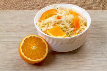 Bowl with cabbage and orange