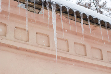 In the winter season, icicles hanging on the house
