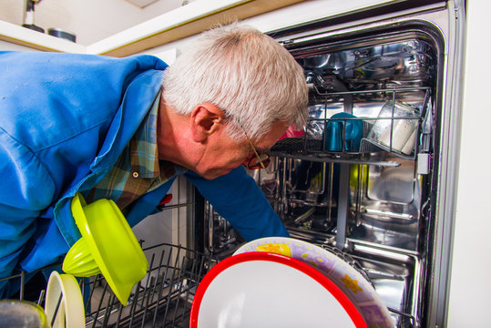 Service Man Fixing Dish Washer Machine