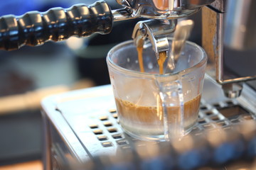 How to making coffee with hot coffee maker machine, selective focus and free space for text, Industrial food and drink concept.