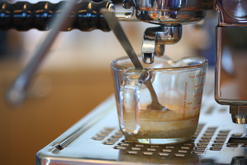 How to making coffee with hot coffee maker machine, selective focus and free space for text, Industrial food and drink concept.