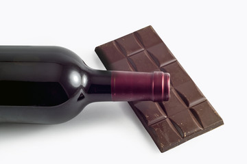  Bottle of wine and chocolate bar on white background