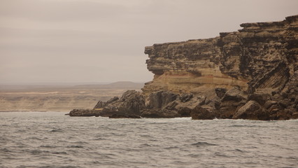 Fototapeta na wymiar rugged sandstone cliffs in southern Angola on the Atlantic coast
