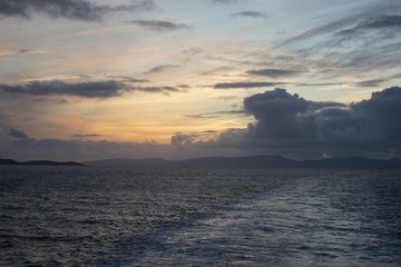 Obraz na płótnie Canvas Ferry Away from the Island Sunset 13