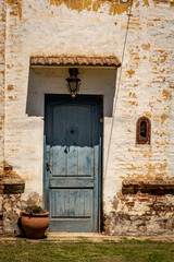 Old blue door. Entrance of an old house.