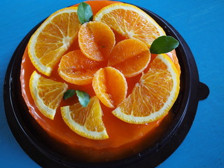 Fototapeta na wymiar Orange Cake with orange topping