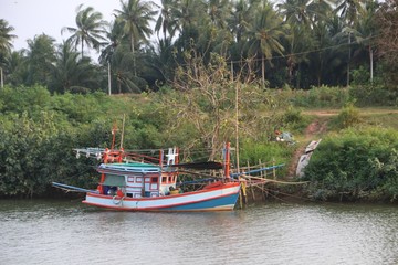 A small fishing boat is floating