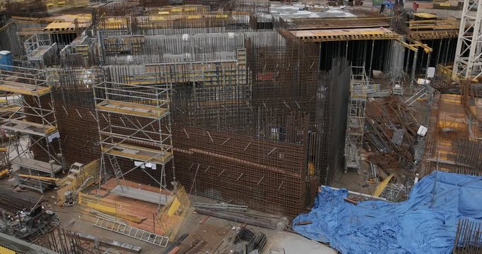 4K Footage of a uncomplete new building been built where the scaffolding and structure is still been layed. - Video