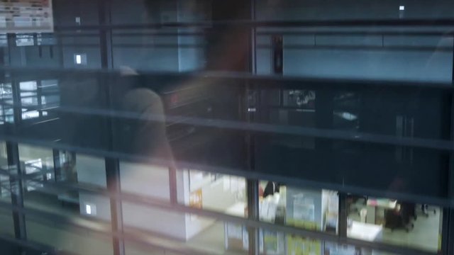 Inside the glass elevator in building while moving