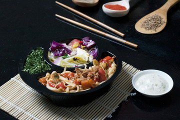 asian food, ready meal to eat in lunch box with sticks and sauce