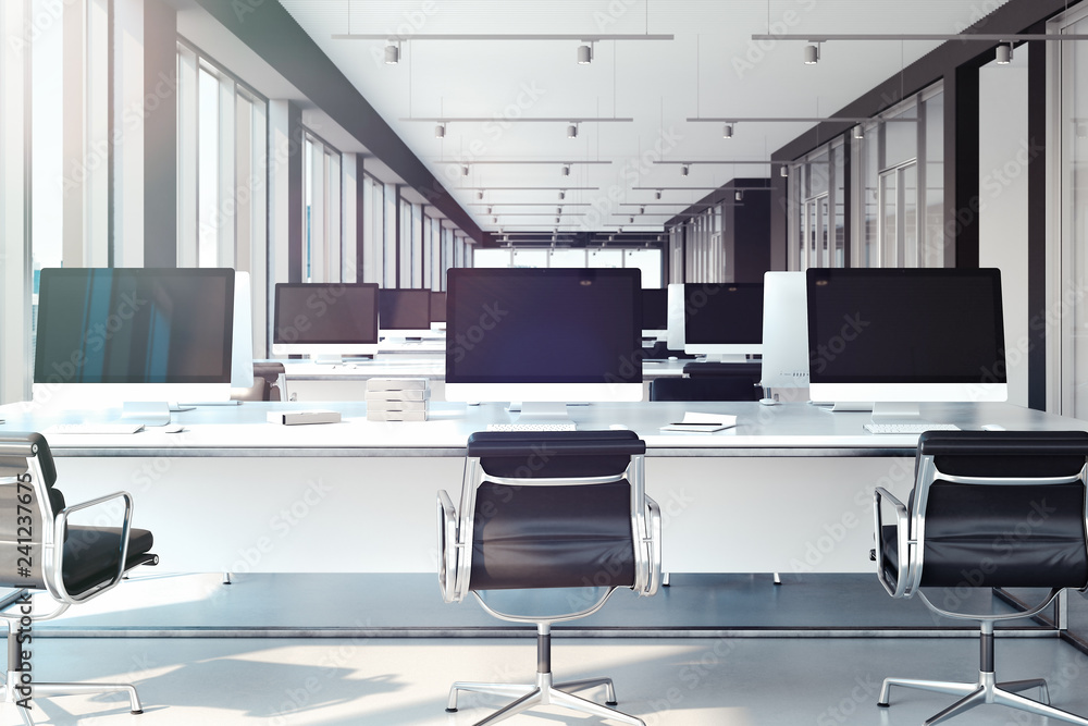 Poster pcs with big blank monitors on tables. open workspace at office. 3d rendering.