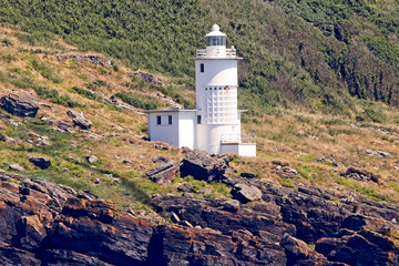 Fototapeta na wymiar Tater Du Lighthouse was built in the 1960's, Cornwall, England, UK.