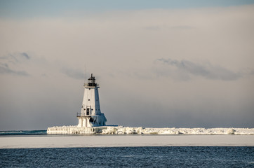 Ice, Sun, and Reflections at the Lighthouse