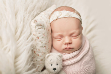 newborn girl on a white background