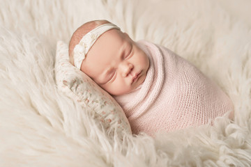 newborn girl on a white background
