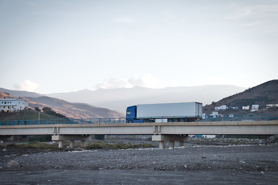 Truck circulating on a bridge over a dry river in Oued Laou, Chaouen province, in the Tangier Tetuan region, in northern Morocco.