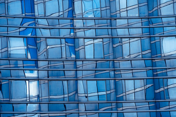 Fototapeta na wymiar Business concept - detail of a corporate building in blue tones