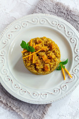 Porridge made from quinoa and pumpkin with mint.
