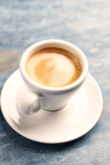 Cup of coffee on rustic wooden background. Close up. Copy space.