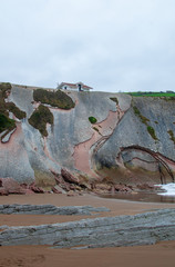 ZUMAIA, BASQUE COUNTRY, SPAIN - 2018 - Hermitage of San Telmo, famous for appearing in the highest grossing film of Spain "8 Basque surnames", on the flysh of the beach.