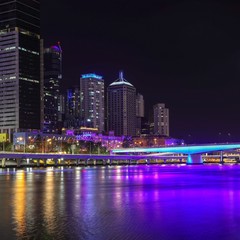 Fototapeta na wymiar Brisbane City (Queensland, Australia) at night featuring purple light