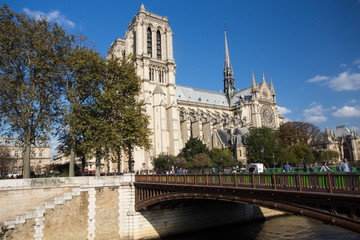 View of Notre Dame Cathedral in Paris France along Seine River 
