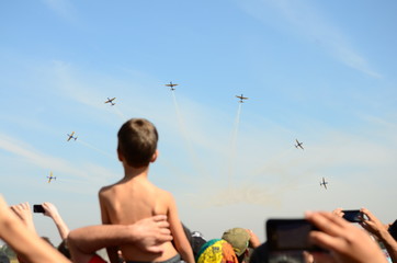 Aircraft A-29 Super Tucano, formation flight viewed by a kid.
