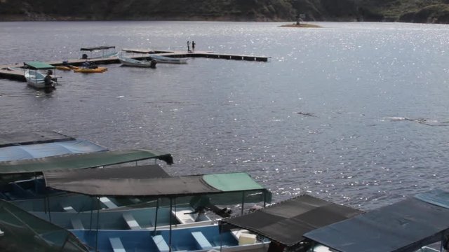 Pier and botas at Tzibantza Lake in Queretaro