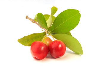 fresh organic acerola with green leaves, isolated on white background with clipping path