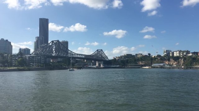 Ferry boats sail under The Story Bridge.It's the longest cantilever bridge in Australia, spanning the Brisbane River in Brisbane Queensland, Australia.