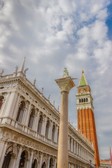 Fototapeta na wymiar Piazza San Marco of Venice: National Library ,Column of San Teodoro, Campanile.